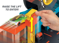 Hot Wheels City Super Twist Tire Shop Playset, Spin The Key to Make Cars Travel Through The Tires, Includes 1 Hot Wheels Car, Gift for Kids 4 to 8 Years Old